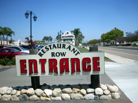 The Restaurant Row entrance sign and landscaping in San Marcos, California